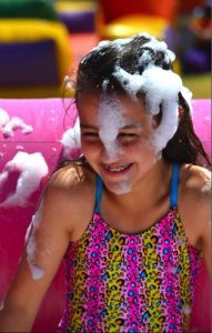 60th birthday celebration girl covered in foam