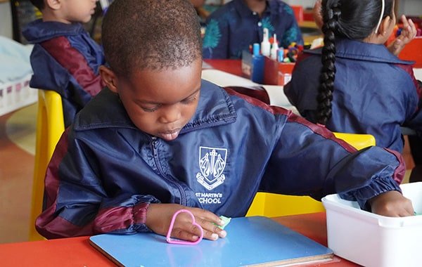 Pre-Preparatory school boy busy with an activity