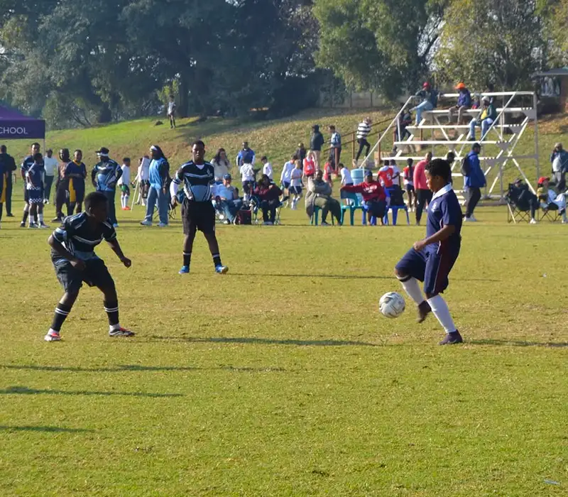 Learners competing in a soccer match at the Winter Sports Day