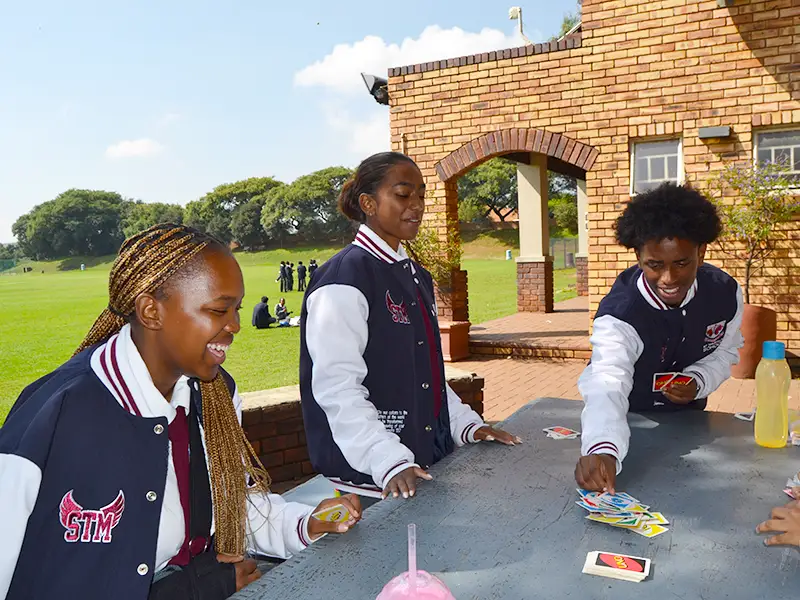 friends playing card games outdoors