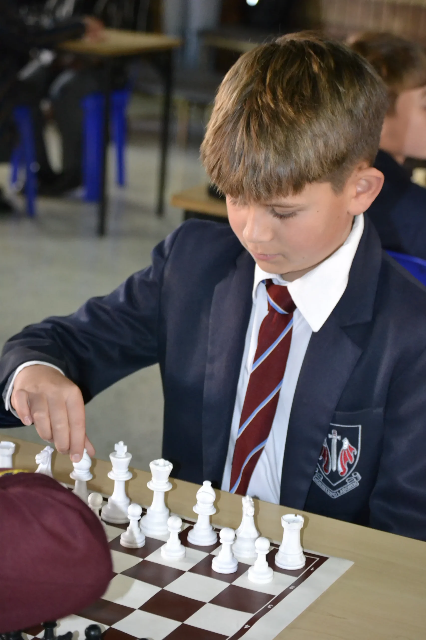 Boy playing at a chess tournament