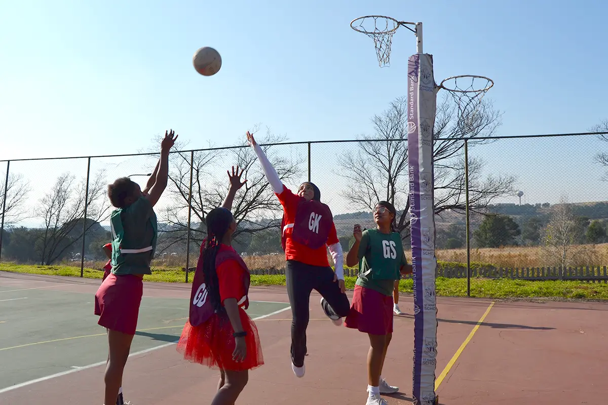 netball girl takes a shot at the net