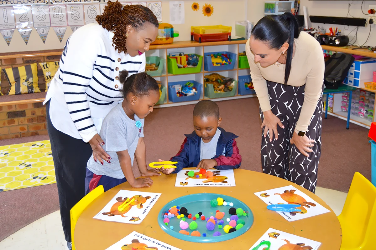 Pre prep students do class activities with parents and teacher